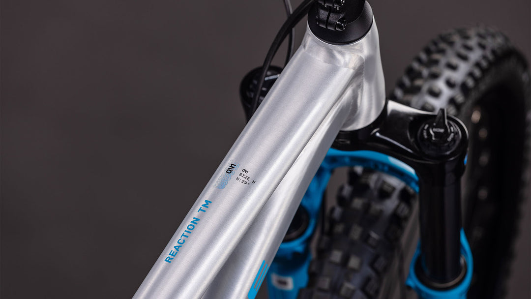 BICICLETA CUBE REACTION TM ONE RAWMETAL BLUE 2026