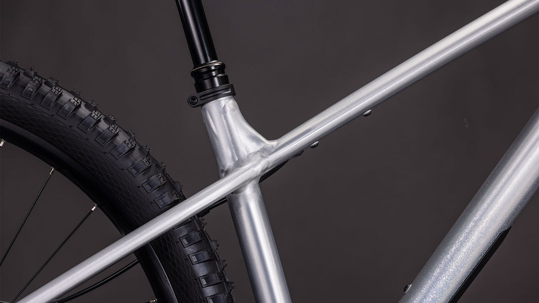 BICICLETA CUBE REACTION TM ONE RAWMETAL BLUE 2026